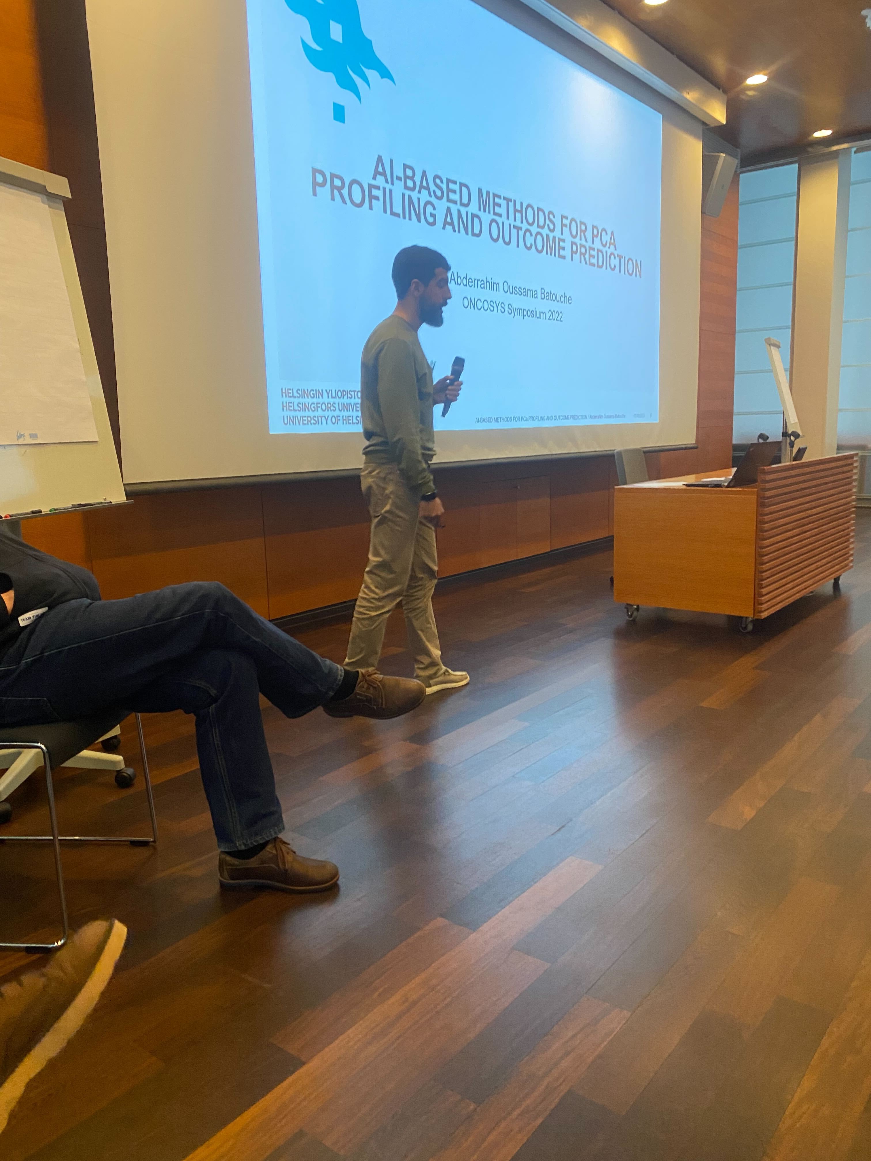 Oussama Batouche presenting AI-based methods for prostate cancer profiling and outcome prediction at ONCOSYS Symposium 2022 in Majvik, Finland.